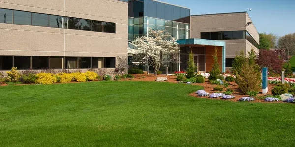 commercial building with nice healthy green front lawn